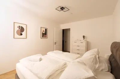 Ein Bett oder Betten in einem Zimmer der Unterkunft Melody Apartments Vienna