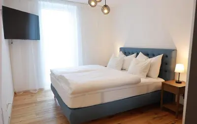 Ein Bett oder Betten in einem Zimmer der Unterkunft Apartments Kellergasse