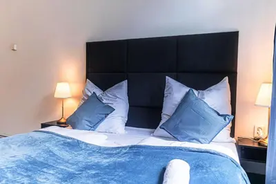 Ein Bett oder Betten in einem Zimmer der Unterkunft Pleasant 2BR Apartment Near U6 Station am Schöpfwerk