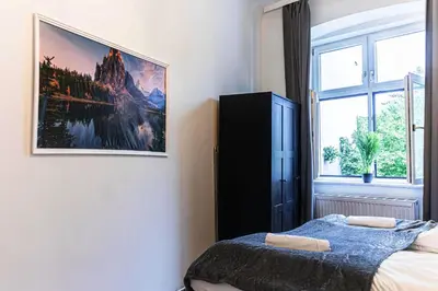Ein Bett oder Betten in einem Zimmer der Unterkunft Pleasant 2BR Apartment Near U6 Station am Schöpfwerk