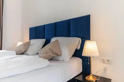 Ein Bett oder Betten in einem Zimmer der Unterkunft Stylish 2BR Apartment 11 Min to Meidling Station