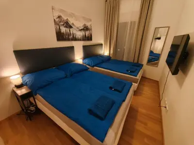 Ein Bett oder Betten in einem Zimmer der Unterkunft Luxury Central Apartment with Garden