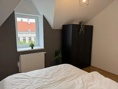 Ein Bett oder Betten in einem Zimmer der Unterkunft 50qm, balcony, near center, Schönbrunn, attic