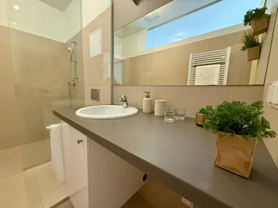 Ein Badezimmer in der Unterkunft Giardino Airport Apartment with garden