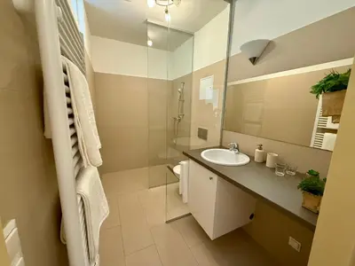 Ein Badezimmer in der Unterkunft Giardino Airport Apartment with garden