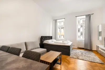 Ein Sitzbereich in der Unterkunft Harmony-Heights Apartment