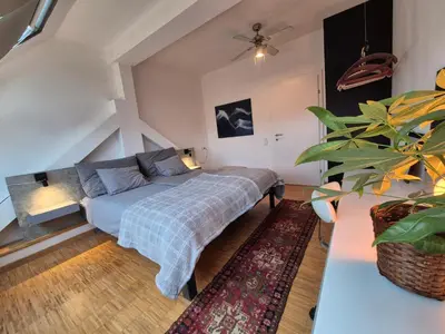 Ein Bett oder Betten in einem Zimmer der Unterkunft Rooftop Loft