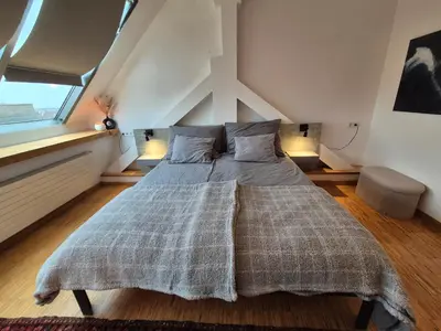 Ein Bett oder Betten in einem Zimmer der Unterkunft Rooftop Loft