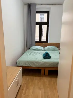 Ein Bett oder Betten in einem Zimmer der Unterkunft Cozy 2 rooms family apartment