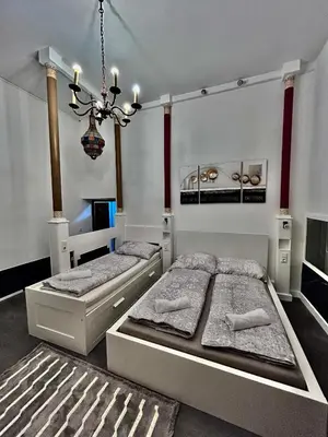 Ein Bett oder Betten in einem Zimmer der Unterkunft Vienna-Guestroom