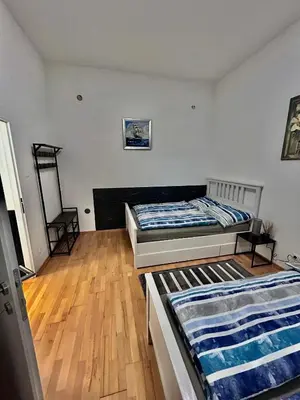 Ein Bett oder Betten in einem Zimmer der Unterkunft Vienna-Guestroom