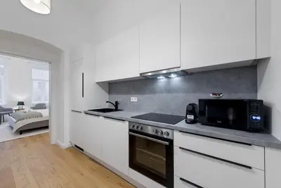 Küche/Küchenzeile in der Unterkunft Schönbrunn Maison - Boutique 2 BR Residence in Viennas Greenest Quarter - by 4ty3 Apartments