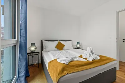 Ein Bett oder Betten in einem Zimmer der Unterkunft NobleNest Cozy - Parkplatz - Terrasse - Küche