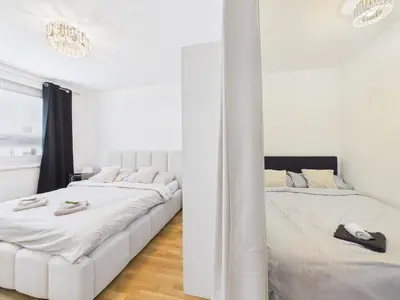 Ein Bett oder Betten in einem Zimmer der Unterkunft Apartment near Donau with Parking Garage