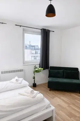 Ein Bett oder Betten in einem Zimmer der Unterkunft Zeus Design Apartments Rosenpark
