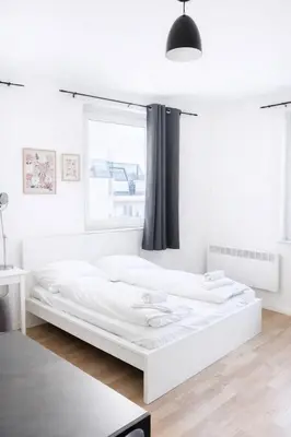 Ein Bett oder Betten in einem Zimmer der Unterkunft Zeus Design Apartments Rosenpark