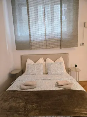 Ein Bett oder Betten in einem Zimmer der Unterkunft Urania City Residence