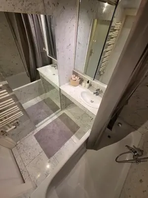 Ein Badezimmer in der Unterkunft Urania City Residence