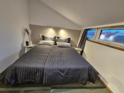 Ein Bett oder Betten in einem Zimmer der Unterkunft Rooftop Loft 2