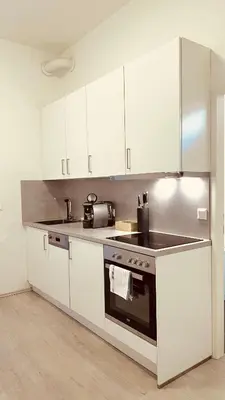 Küche/Küchenzeile in der Unterkunft SERVUS HOMES Apartments Vienna - Metro Stadthalle