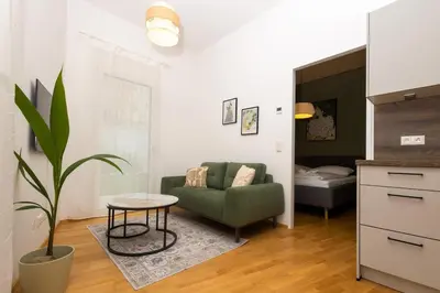 Ein Sitzbereich in der Unterkunft Modern apartment with garden & top connection