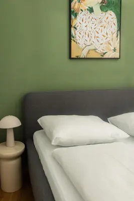 Ein Bett oder Betten in einem Zimmer der Unterkunft Modern apartment with garden & top connection