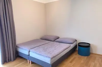 Ein Bett oder Betten in einem Zimmer der Unterkunft Apartment in upscale district with wellness area