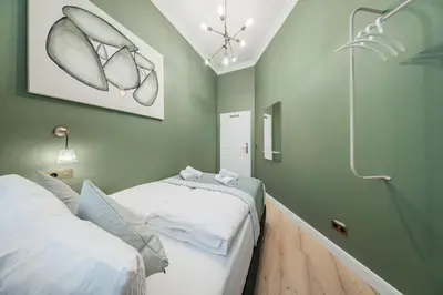 Ein Bett oder Betten in einem Zimmer der Unterkunft HOME1 - Belvedere Boutique Hostel
