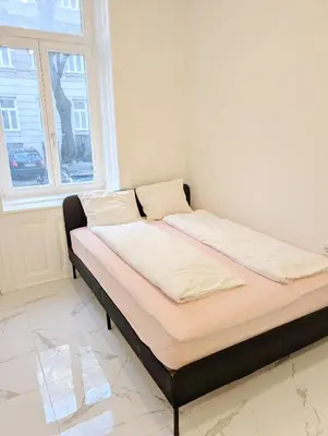 Ein Bett oder Betten in einem Zimmer der Unterkunft Cozy central apartment in Praterstern area 5A