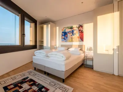 Ein Bett oder Betten in einem Zimmer der Unterkunft Apartment Skyflats Hills View by Interhome