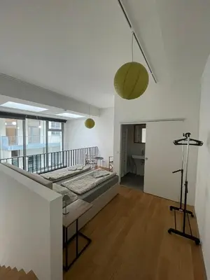 Ein Bett oder Betten in einem Zimmer der Unterkunft Modern Loft mit Terrasse