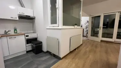 Küche/Küchenzeile in der Unterkunft Lovely 3BR Apartment with Balcony near Rennweg station