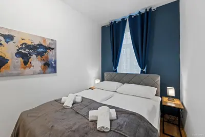 Ein Bett oder Betten in einem Zimmer der Unterkunft Nüll Residences 13 - 2 Bedrooms close to main station