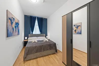 Ein Bett oder Betten in einem Zimmer der Unterkunft Nüll Residences 13 - 2 Bedrooms close to main station