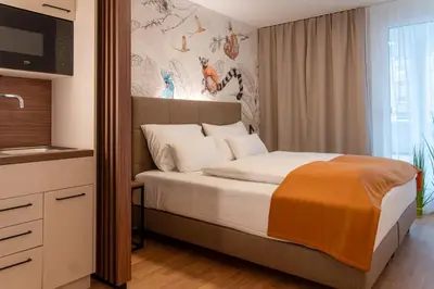 Ein Bett oder Betten in einem Zimmer der Unterkunft OLIVER pulse I Apartments with self check-in