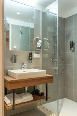 Ein Badezimmer in der Unterkunft OLIVER pulse I Apartments with self check-in