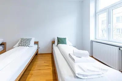 Ein Bett oder Betten in einem Zimmer der Unterkunft Brown Stag Apartments by JR City Apartments
