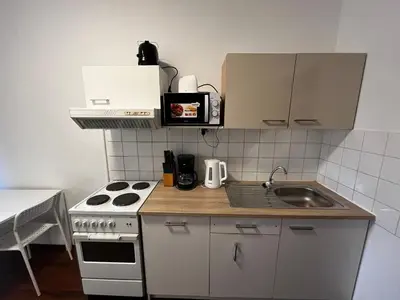 Küche/Küchenzeile in der Unterkunft Helle DG-Wohnung in Wien I Ruhig, modern & zentral