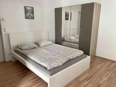 Ein Bett oder Betten in einem Zimmer der Unterkunft Cosy Apartment near Metro & Center