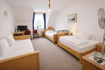 Ein Bett oder Betten in einem Zimmer der Unterkunft Pension Ursula