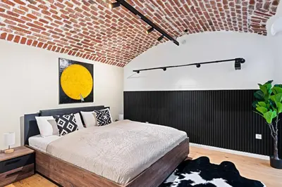 Ein Bett oder Betten in einem Zimmer der Unterkunft Industrialist - Design Suite in Central Vienna