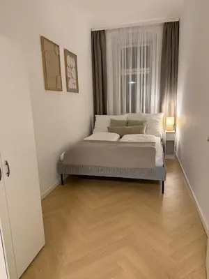 Ein Bett oder Betten in einem Zimmer der Unterkunft Modern ausgestattete Wohnung mit Wiener Charme