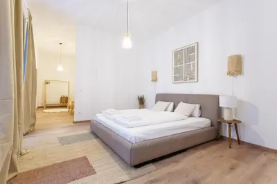 Ein Bett oder Betten in einem Zimmer der Unterkunft Luxury City Center Suite