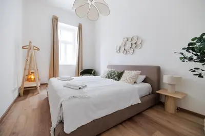 Ein Bett oder Betten in einem Zimmer der Unterkunft Luxury City Center Suite