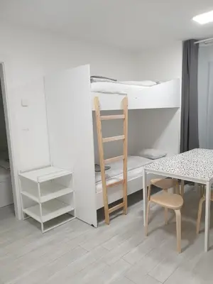 Ein Bett oder Betten in einem Zimmer der Unterkunft AKH Apartments