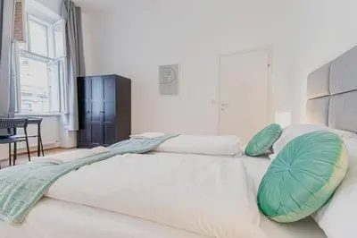 Ein Bett oder Betten in einem Zimmer der Unterkunft Spacious Private Rooms in a Shared Apartment in Vienna