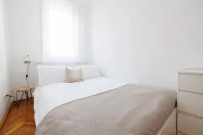 Ein Bett oder Betten in einem Zimmer der Unterkunft Operastreet Residences - Piano Suite