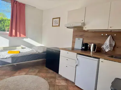 Küche/Küchenzeile in der Unterkunft Cozy City Apartment - Free Parking & Fitness