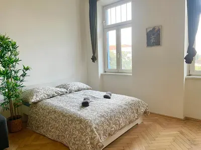 Ein Bett oder Betten in einem Zimmer der Unterkunft Cozy Long-Term Apartment