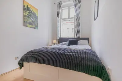 Ein Bett oder Betten in einem Zimmer der Unterkunft Modern Three Bedroom Apartment Close to Stadthalle